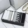 Organisateur de tiroir en carton gris et noir. Taille L